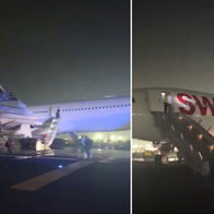 Swiss flight to Zurich evacuates all passengers via slides.