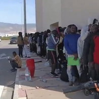 Massive queues in the elements in Roquetas del Mar, Almeria.