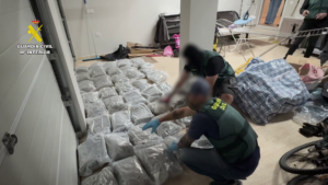Police officers in Spain discovering narcotics in a house