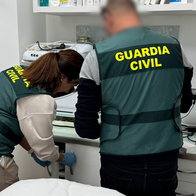 Police officers in Spain raid a beauty clinic