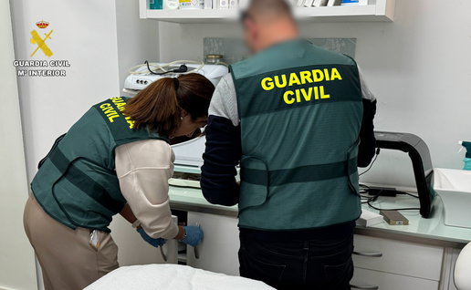Police officers in Spain raid a beauty clinic