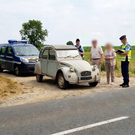 Elderly couple in 2CV pulled over by French cops.