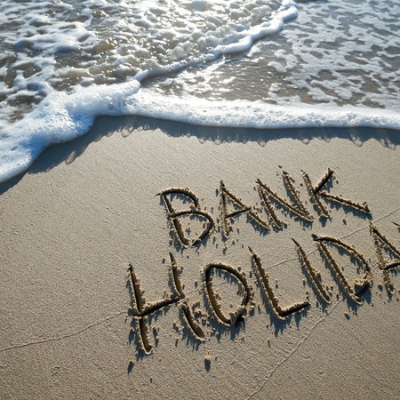 Bank holiday message written on a beach as Spain confirms new May holidays for some workers in 2026.