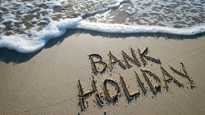 Bank holiday message written on a beach as Spain confirms new May holidays for some workers in 2026.