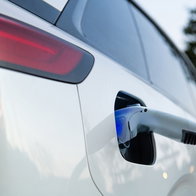 Electric vehicle charging at a public charging point, highlighting the growing focus on battery transparency under new EU rules.