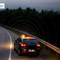 Official DGT image showing a car stopped on a road at night using a connected V16 emergency warning light in Spain.