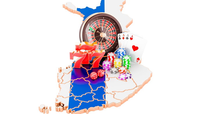3d concept of Casino items roulette wheel, slot, chips, cards on a Finnish flag