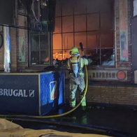 Malaga firefighters tackle massive Le Grand Cafe fire.