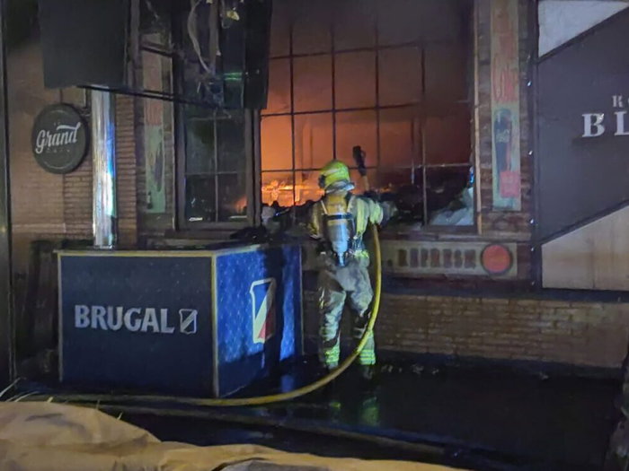 Malaga firefighters tackle massive Le Grand Cafe fire.