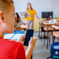 Children on phones in learning environment