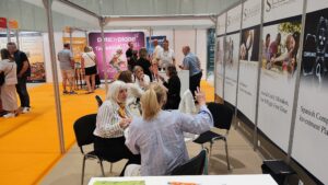 Lorraine & Fiona talking with clients.