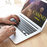 Man playing poker online on a laptop