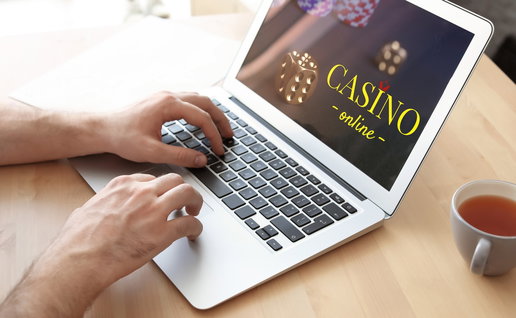 Man playing poker online on a laptop