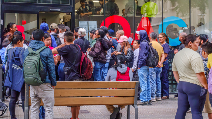 Long queues outside a citizen advice and immigration service centre in Barcelona