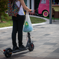 A women riding on an electric scooter