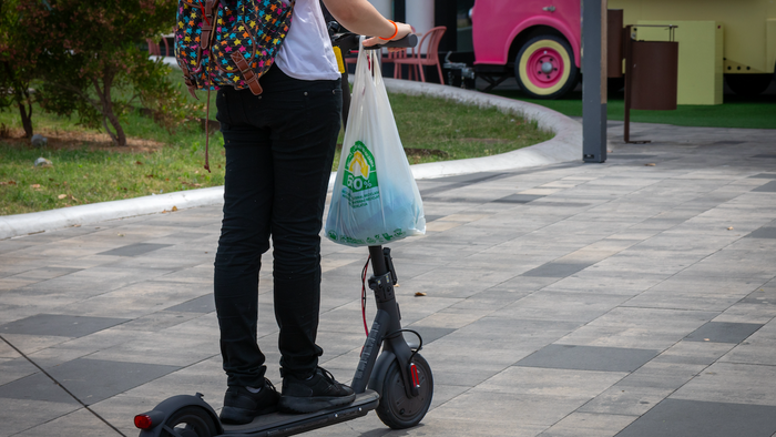 A women riding on an electric scooter
