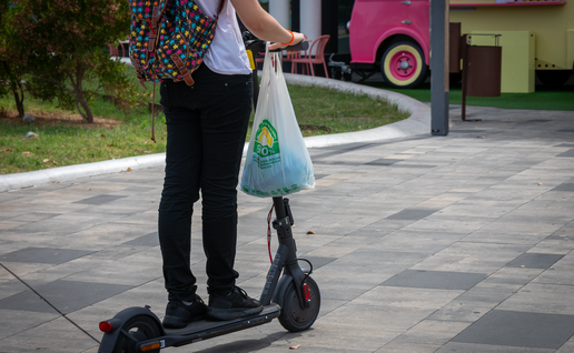A women riding on an electric scooter