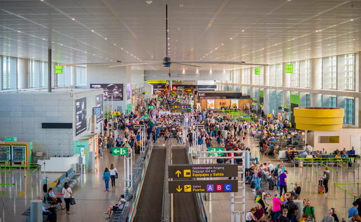 Passengers queueing to board there flights in Malaga airport