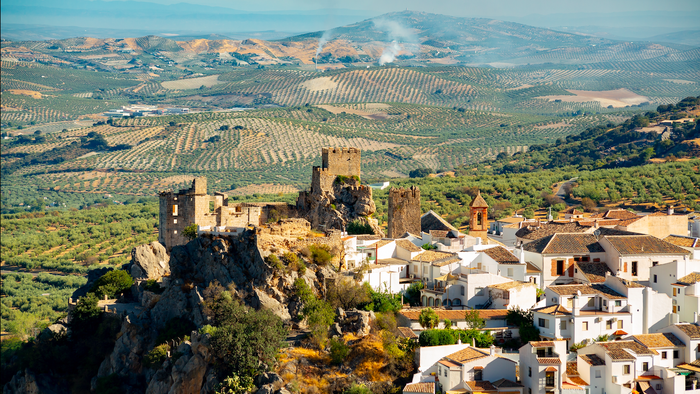 A village in Spain sat on a hill with a castle