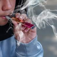 Youth smoking a vape