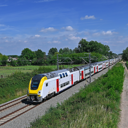 A train in Belgium travel through the countryside