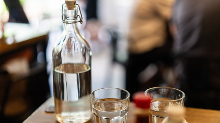 Tap water being served in a restaurant