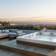 Outdoor spa on a penthouse terrace with a view looking out to sea