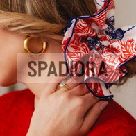 Pretty lady wearing a hair scrunchie by Spadiora