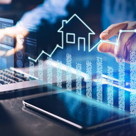 Real Estate person using laptop doing a plan