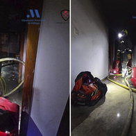 Blackened shell of flat left after blaze.