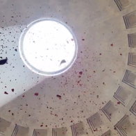 Millions of rose petals fall from Pantheon roof.