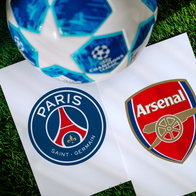 Football with Champions Leauge logo with the club logos for Arsenal & PSG