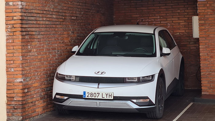 Car parked inside a private garage space in Spain