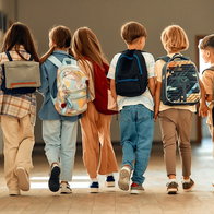 school children with backpacks on first day of school