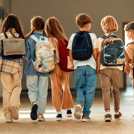 school children with backpacks on first day of school