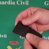 Guardia Civil officers demonstrate a concealed knife disguised as a wallet sized card during a social media warning video in Spain.