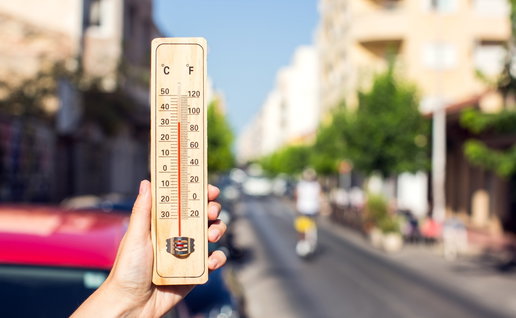 Thermometer showing extreme heat on a sunny street as Spain records its hottest April on record.
