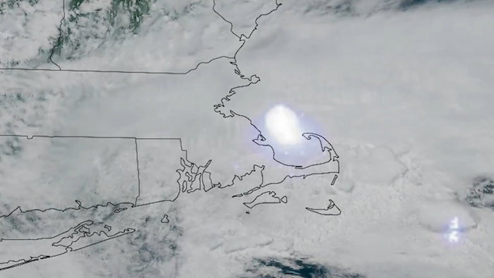 Satellite image showing the bright flash of a meteor as it exploded in the atmosphere above the Massachusetts and New Hampshire region.