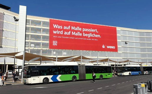 Large Wero advertising billboard displayed on the parking structure at Palma de Mallorca Airport, the campaign at the centre of a political controversy over tourism image.