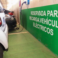 Electric vehicles charging in a reserved EV charging area in Spain as the country expands its rapid charging network.