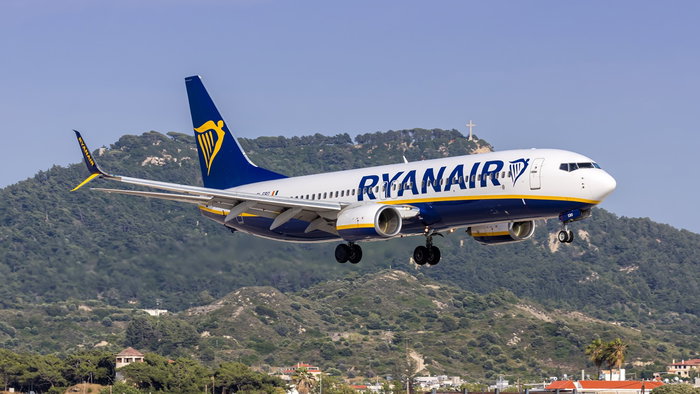 Ryanair aircraft landing in Greece as the airline announces major winter flight cuts and base closures.