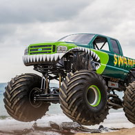 Airborne monster truck at the beach t