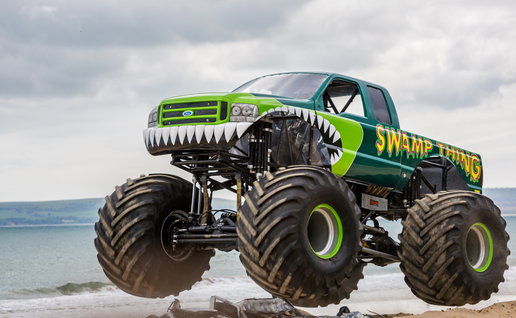 Airborne monster truck at the beach t
