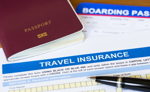 A passport with a boarding pass and travel insurance with a pen on a desk