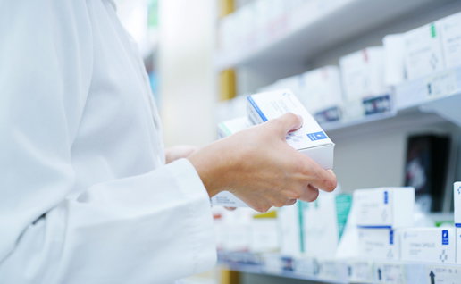 A pharmacists holding medication