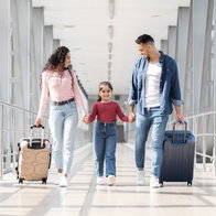 A family of three at the arirport.