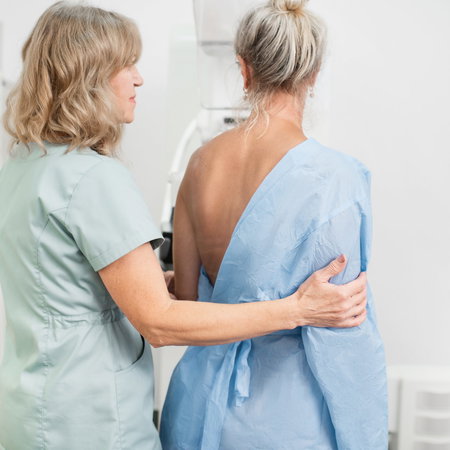 Middle age woman undergoes a mammogram