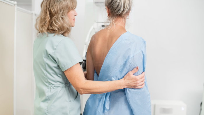 Middle age woman undergoes a mammogram