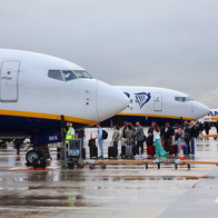 Ryanair Passengers waiting in the rain.