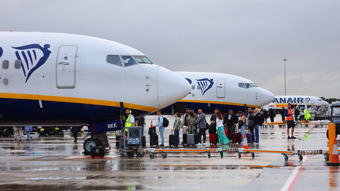 Ryanair Passengers waiting in the rain.